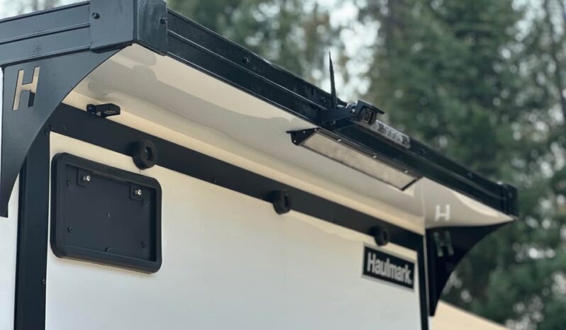 
								2026 Haulmark Nomad 7×16 V-Nose Camper/Toy Hauler Hybrid Trailer full									